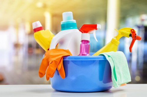 Cleaner treating a living room carpet in Camden Town